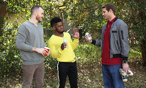 man refusing can of beer