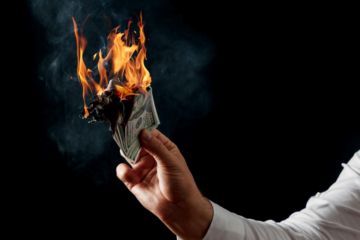 person burning money