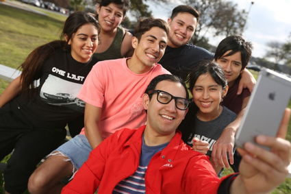 group of people taking selfie